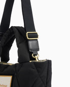 Closed-up view of Barbour Mariah Quilted Mini Tote strap with adjustable buckle