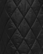 Close up view of the black quilted fabric of Barbour Meredith Quilted Jacket