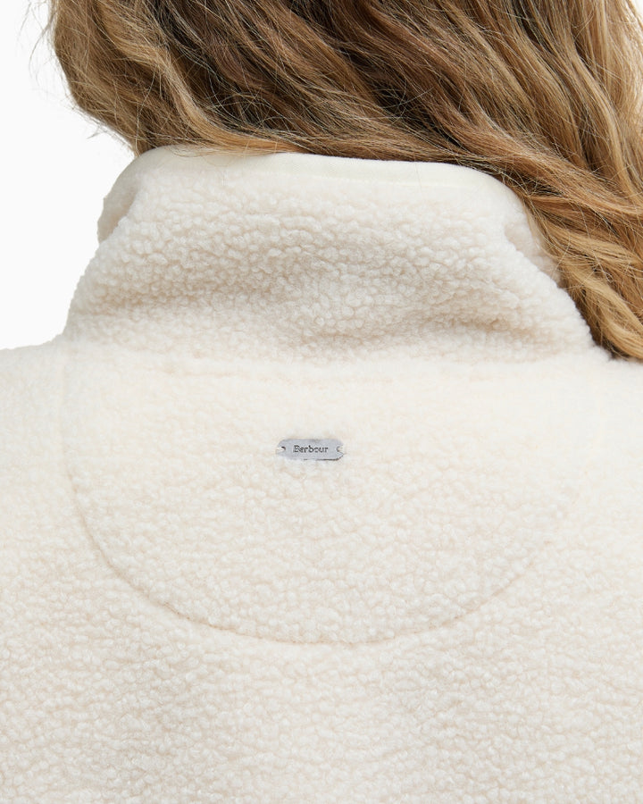 Detailed view of Barbour logo badge at the back of the neck on Mersea fleece