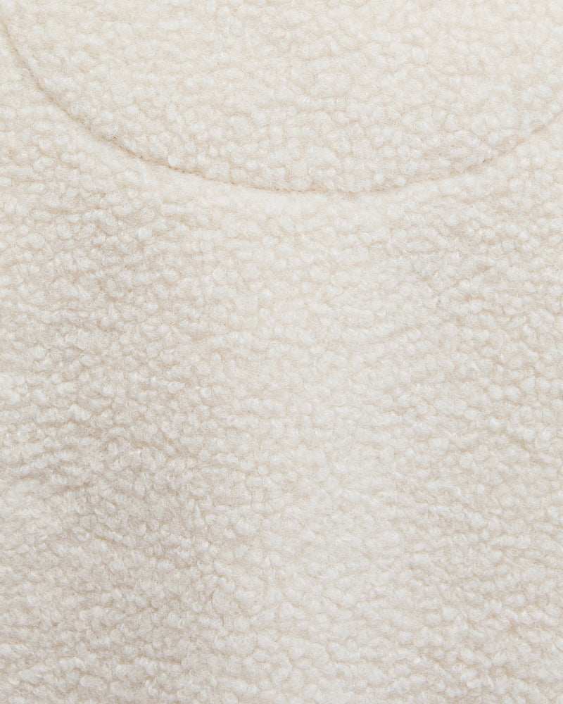 Zoomed-in image of soft fleece fabric texture in natural colour
