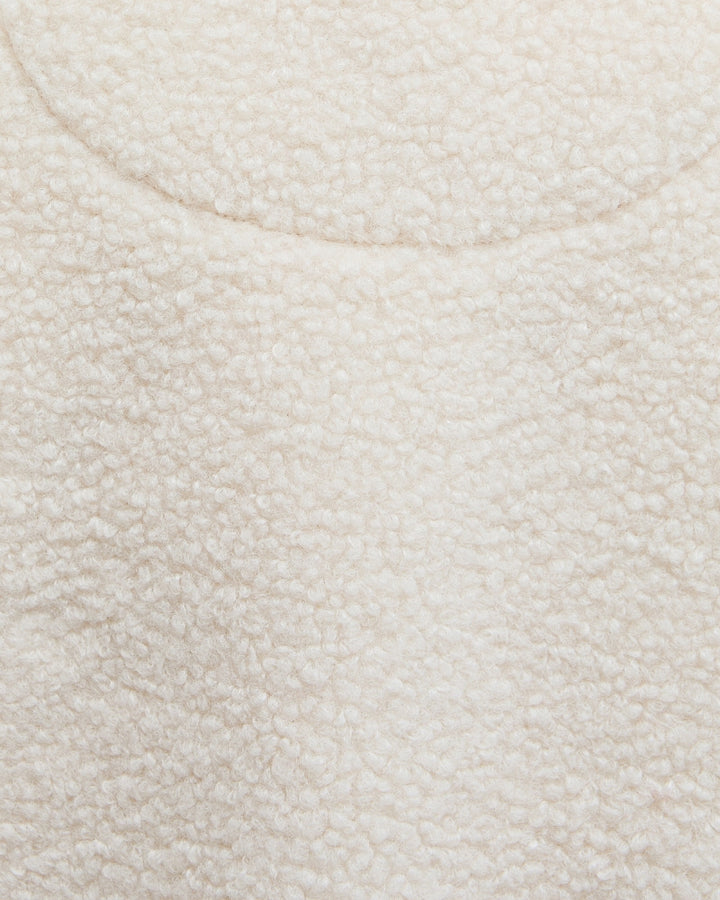 Zoomed-in image of soft fleece fabric texture in natural colour