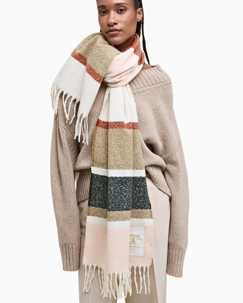 Lifestyle shot of Barbour Paige Striped Scarf styled over a coat