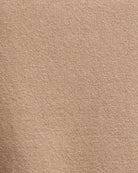 Zoomed-in view of fabric showing fine knit detail and soft camel colouring