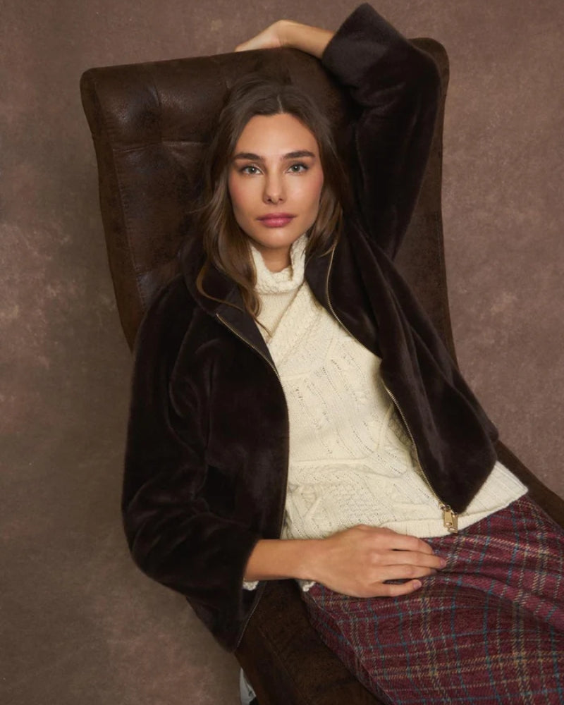 Model wearing Calipolis coat with jeans and ankle boots