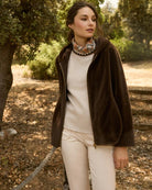 Model wearing Calipolis coat with jeans and ankle boots