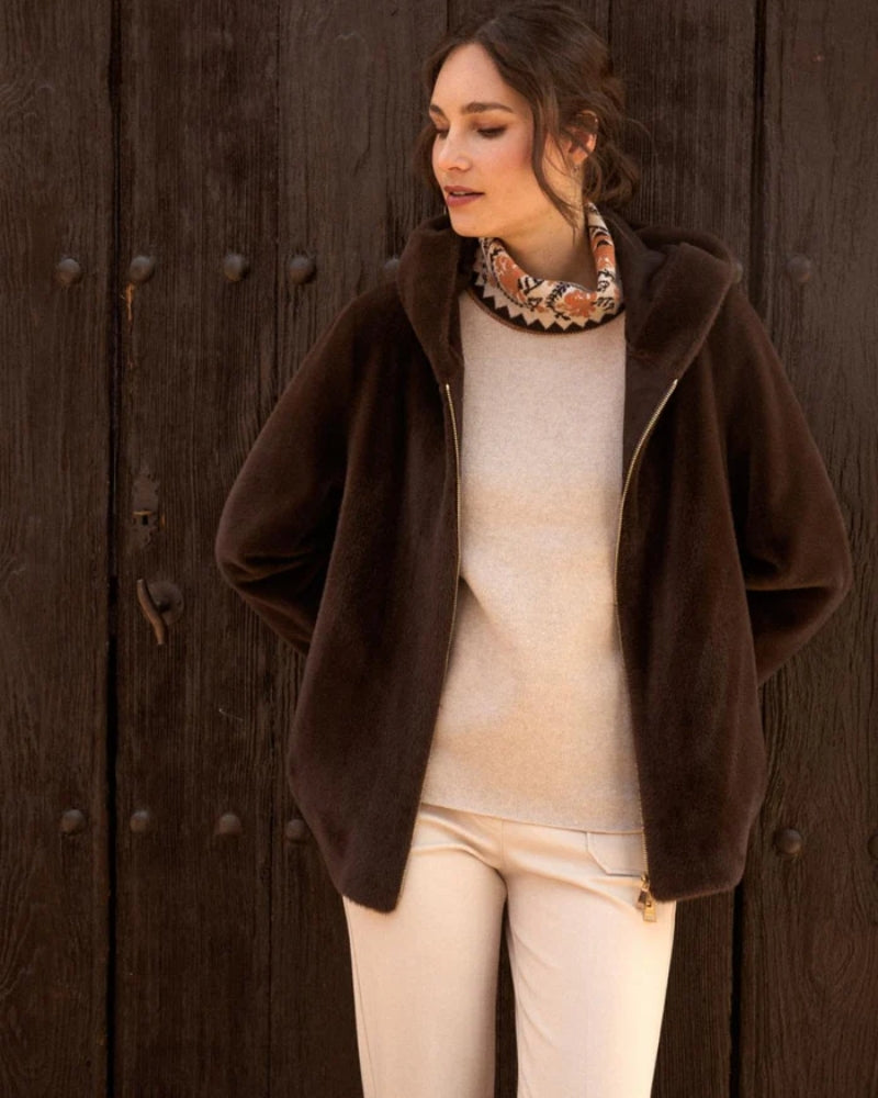 Model wearing Calipolis coat with jeans and ankle boots