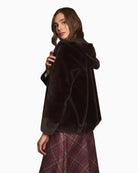 Back view of hooded faux fur coat in rich chocolate colour