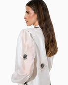 Bariloche Azogue Off White blouse, woman wearing blouse back view 