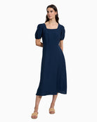 Bariloche Bursa navy dress, front view on model – Áines Boutique