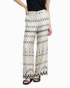 Bariloche Haya trousers white and black front view worn by woman – Áines Boutique