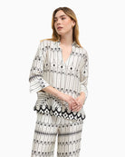 Bariloche Lodosa blouse white and black, front view on model – Áines Boutique