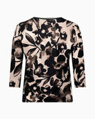 Back view of fitted floral tee showing soft stretch fabric and neat fit
