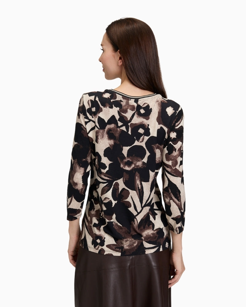 Back view of fitted floral tee showing soft stretch fabric and neat fit