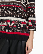 Close-up of bateau neckline and sleeve detail on Betty Barclay floral t‑shirt