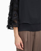 Detail of lightweight polyester fabric and subtle sheen