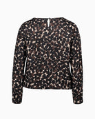 Back view with button loop fastening and relaxed polka dot pattern