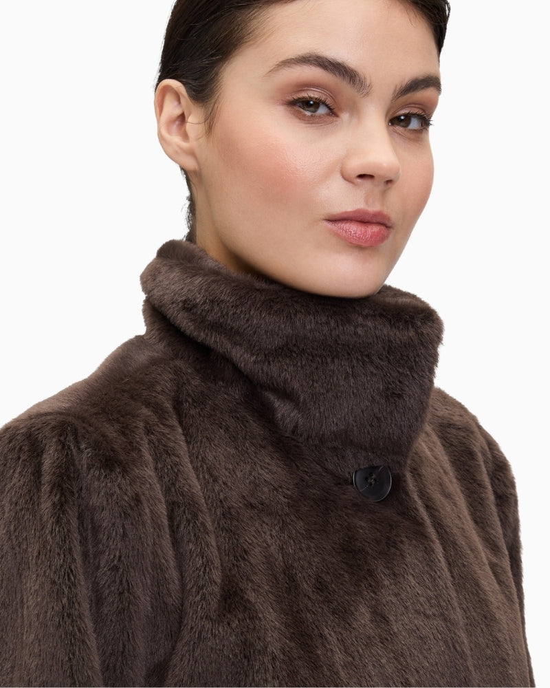 Close up of Plush A-line jacket with stand-up collar and press-stud front