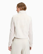 Back view of short plush gilet showing clean lines and soft texture