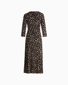 Back view of close-fitting jersey midi dress showing soft drape and dot print

