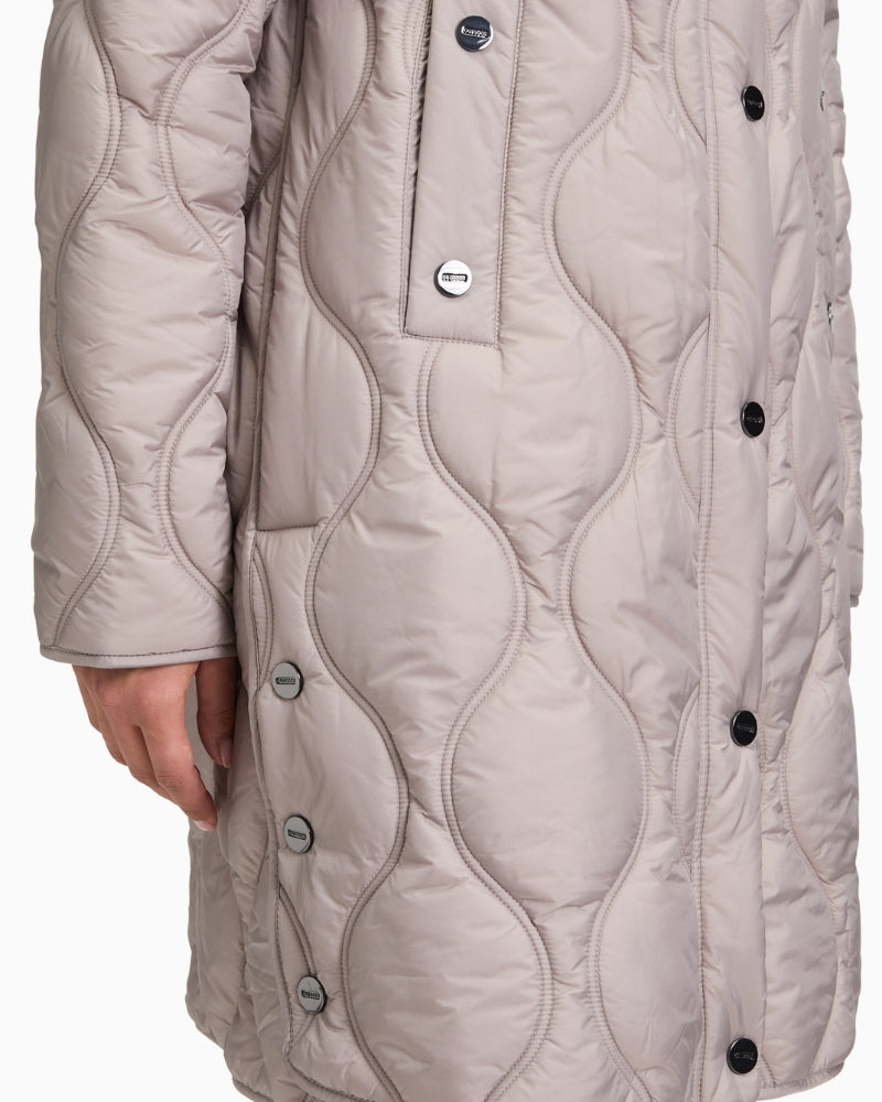 Close-up of zip and press stud detail with piped pocket