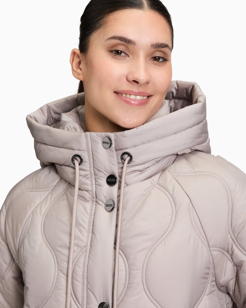 Close-up of zip and press stud detail with piped pocket