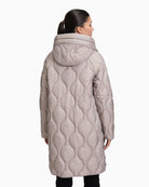 Back view showing longline fit and subtle quilting pattern