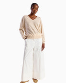 Brodie Cashmere Sea Embroidery Cashmere V Neck Jumper beige front view on model