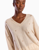 Brodie Cashmere Sea Embroidery Cashmere V Neck Jumper beige neckline detail