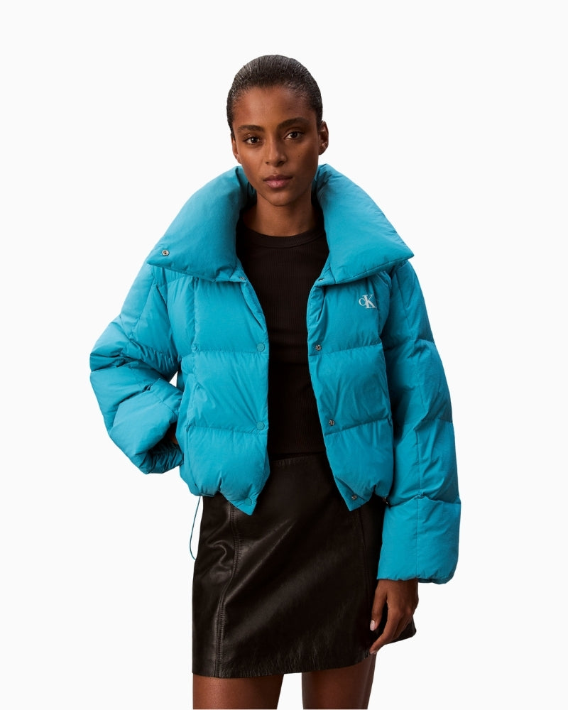 Front view of teal cropped quilted puffer coat