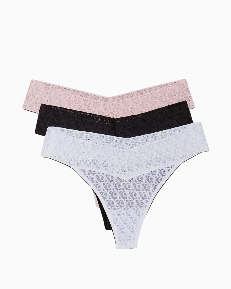 Flat lay of Calvin Klein 3-pack lace thongs in soft, breathable fabric