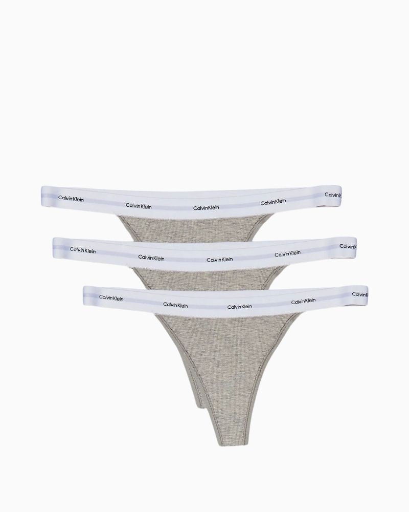 Flat lay of Calvin Klein thong 3-pack in soft cotton blend
