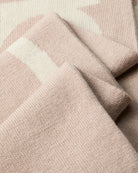 Close-up of CK logo on beige and contrasting tone scarf