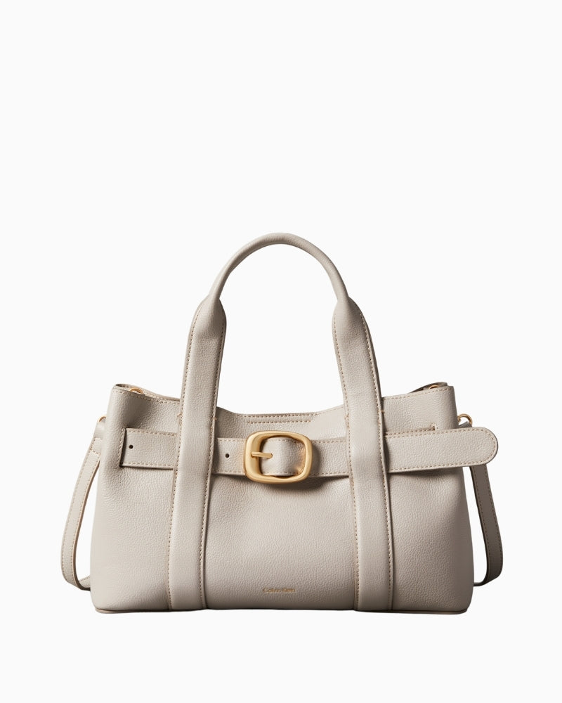 Front view of Calvin Klein taupe mini tote with buckle detail and top handles