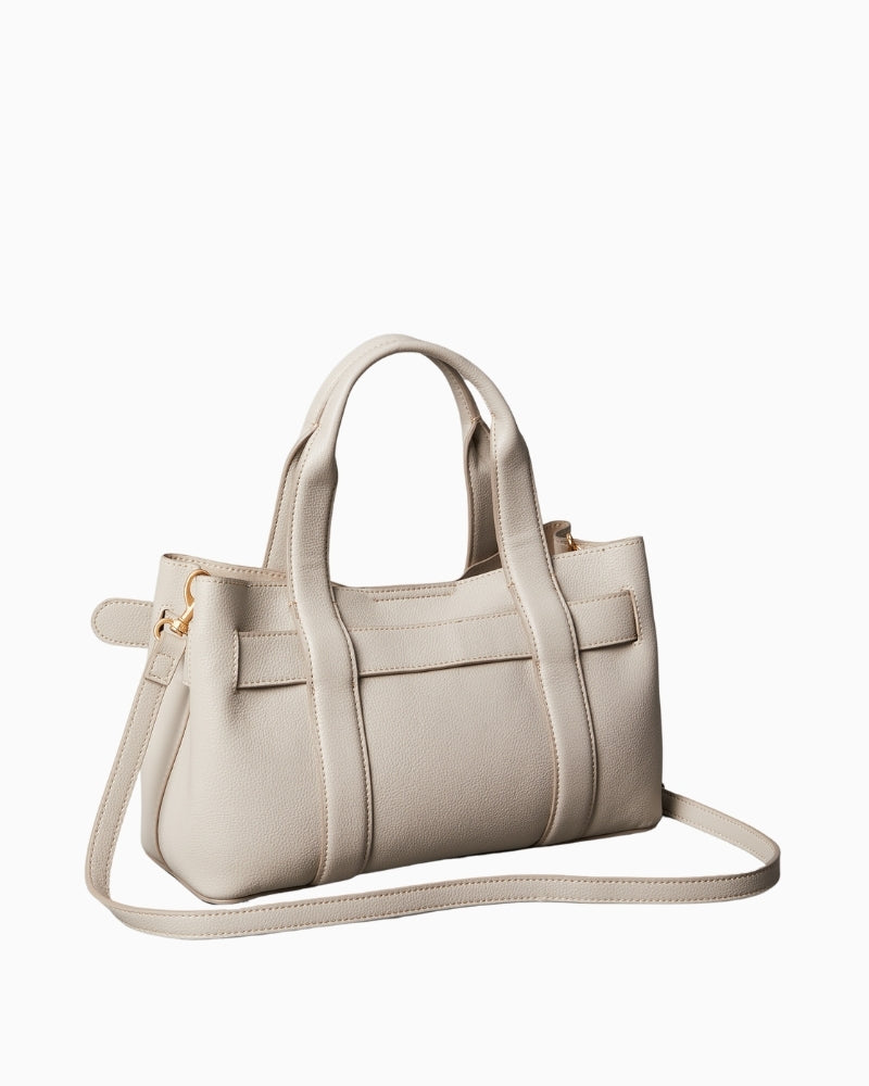 Side profile showing structured shape and long strap attachment