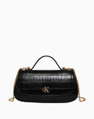 Ergonomic front view of Calvin Klein black croc top-handle bag with chain accent