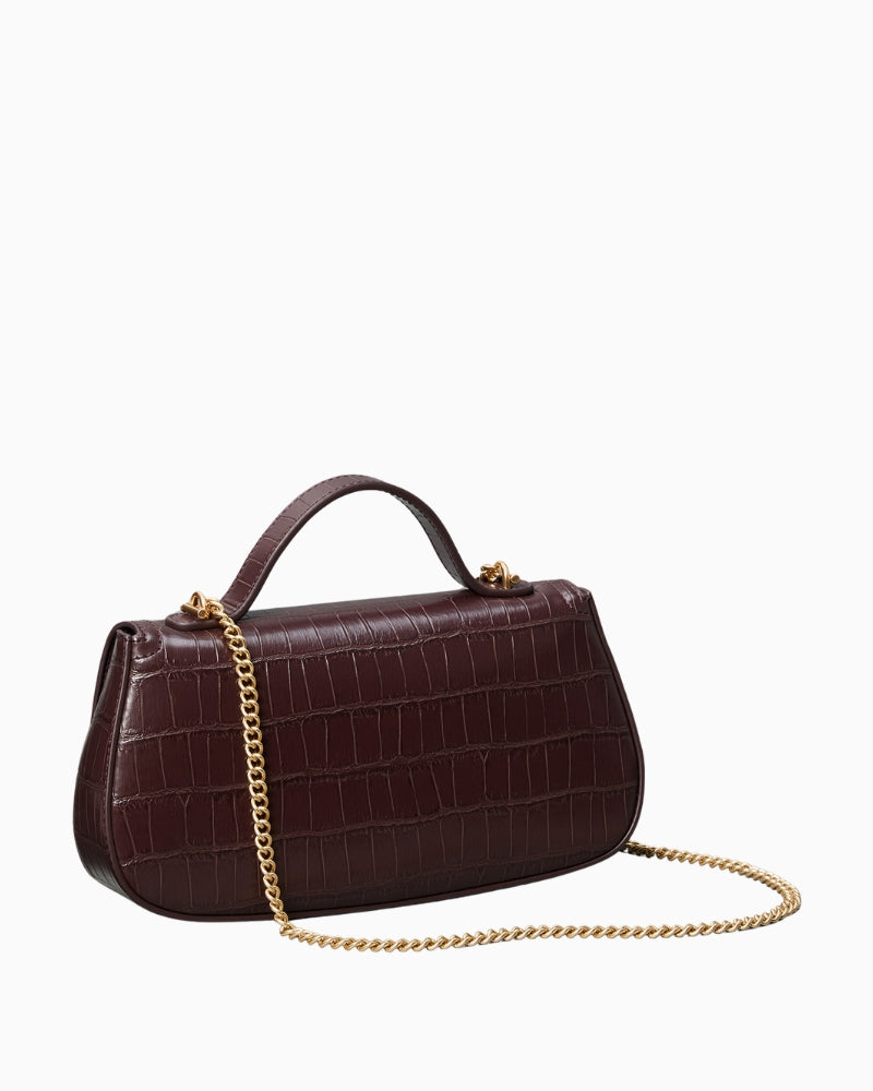 Side profile showing textured croc finish and structured shape