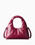 Calvin Klein emblem puffer bag burgundy front view – Áines Boutique