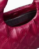 Calvin Klein burgundy puffer bag interior detail – Áines Boutique