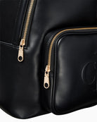 Close-up of Calvin Klein embossed monogram on backpack