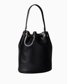 Side view showing structured shape and smooth faux leather finish