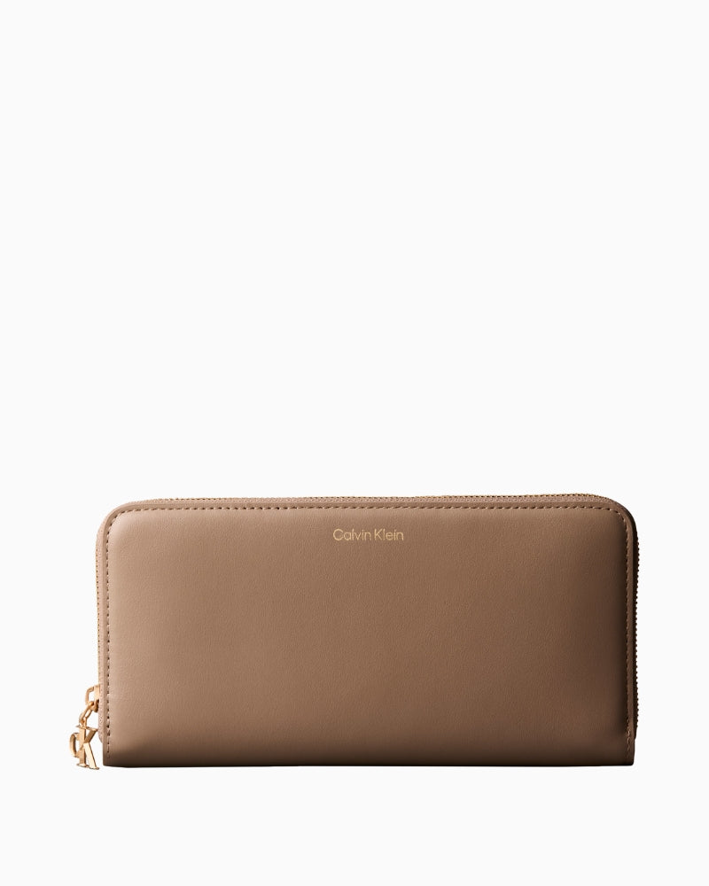 Calvin Klein desert taupe large zip-around wallet front view – Áines Boutique