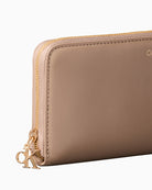 Calvin Klein desert taupe wallet side view with zip detail – Áines Boutique