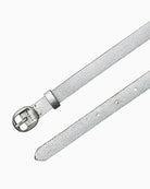 Close-up of pointed end and monogram keeper on slim leather belt