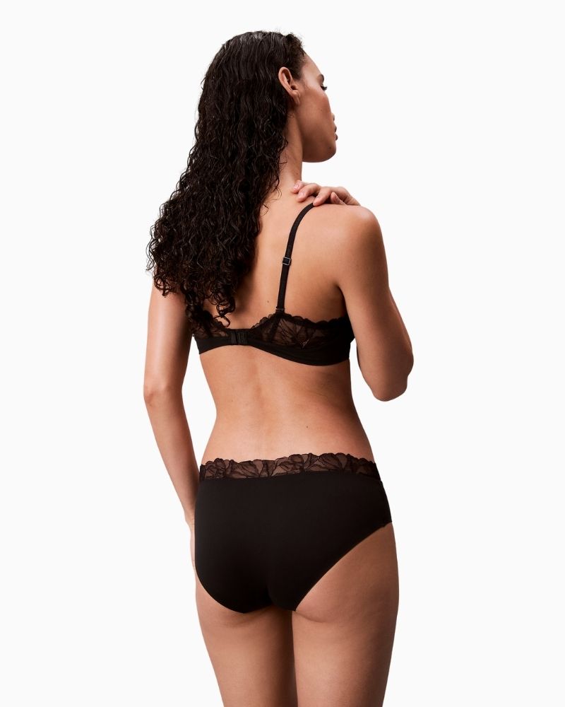 Back view of CK Perfect Coverage Bra in smooth black stretch fabric