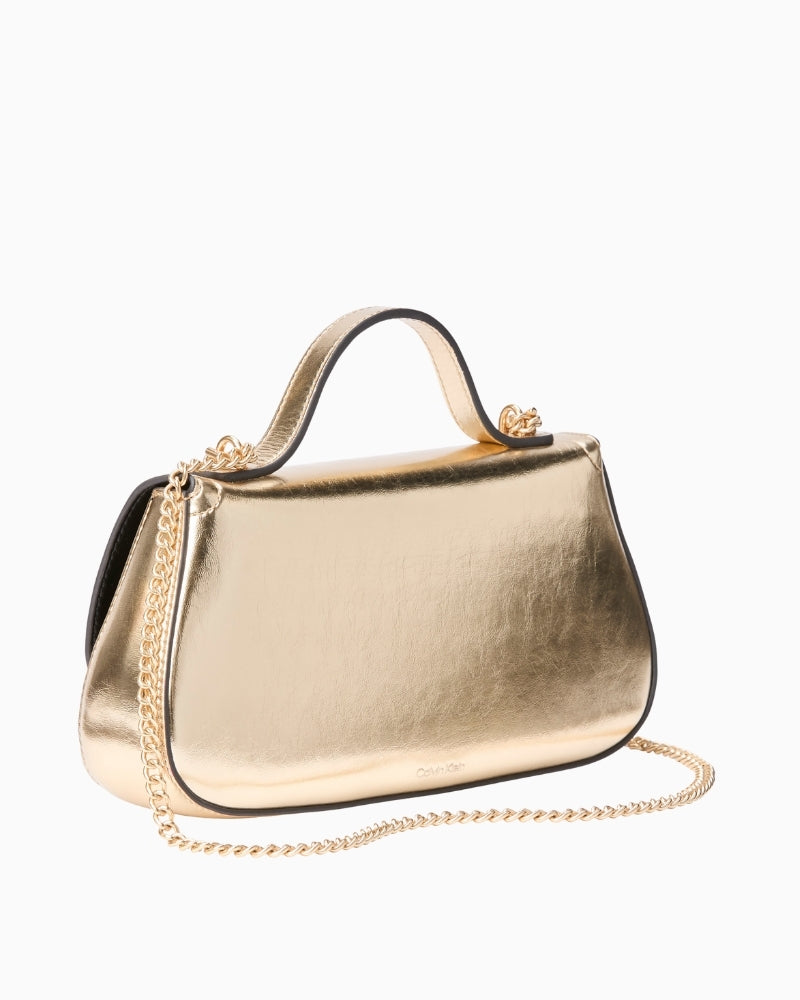 Calvin Klein gold metallic chain bag angled side view – Áines Boutique