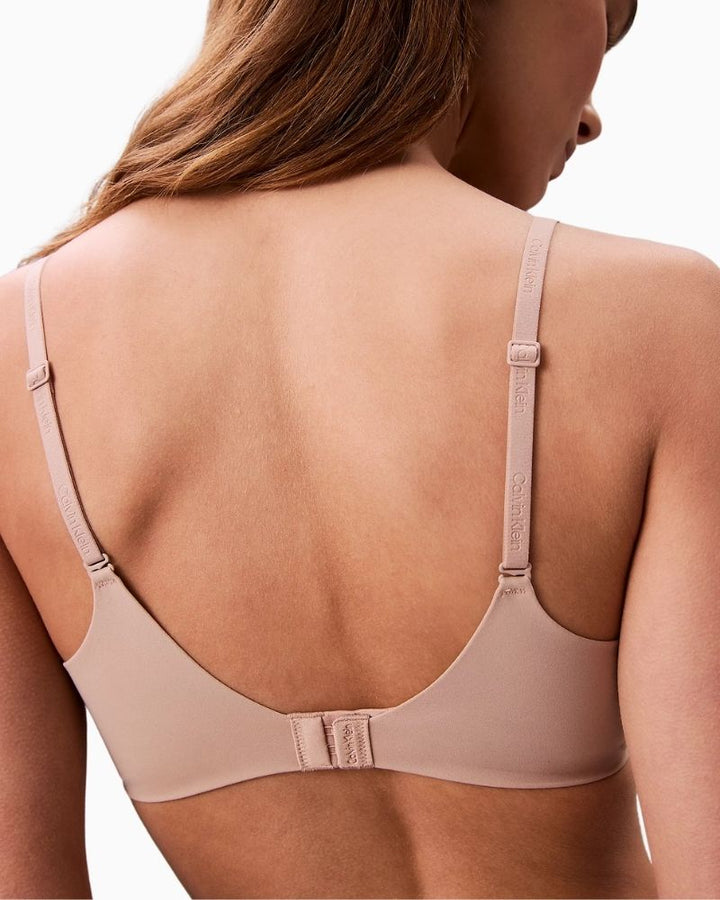 Close-up of Calvin Klein tonal elastic trim on smooth everyday bra