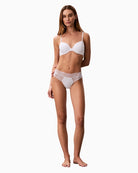 White Calvin Klein lace thong angled front view   – Áines Boutique