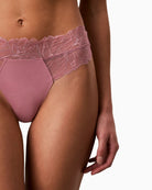 Pink Calvin Klein lace thong fabric close-up with floral motif – Áines Boutique