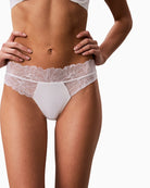 White Calvin Klein lace thong angled front view showing bonded edges – Áines Boutique