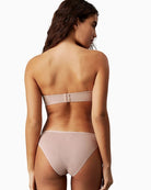Back view highlighting hook fastening and optional straps on Calvin Klein demi bra